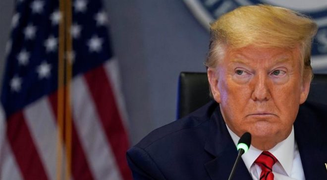 Trump says US topping world virus cases is ‘badge of honour’