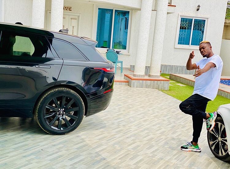 We flaunt cash, cars and mansions in music videos to inspire the youth – Okese1