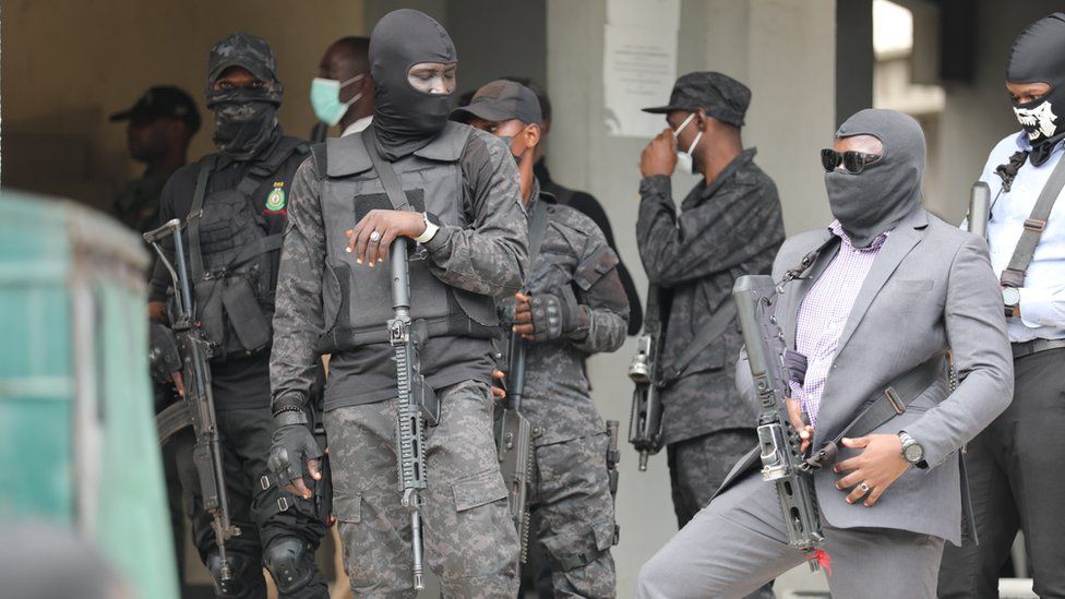 Armed men in balaclavas