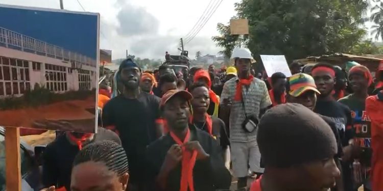 Axim youth demonstrate over locked-up stadium project